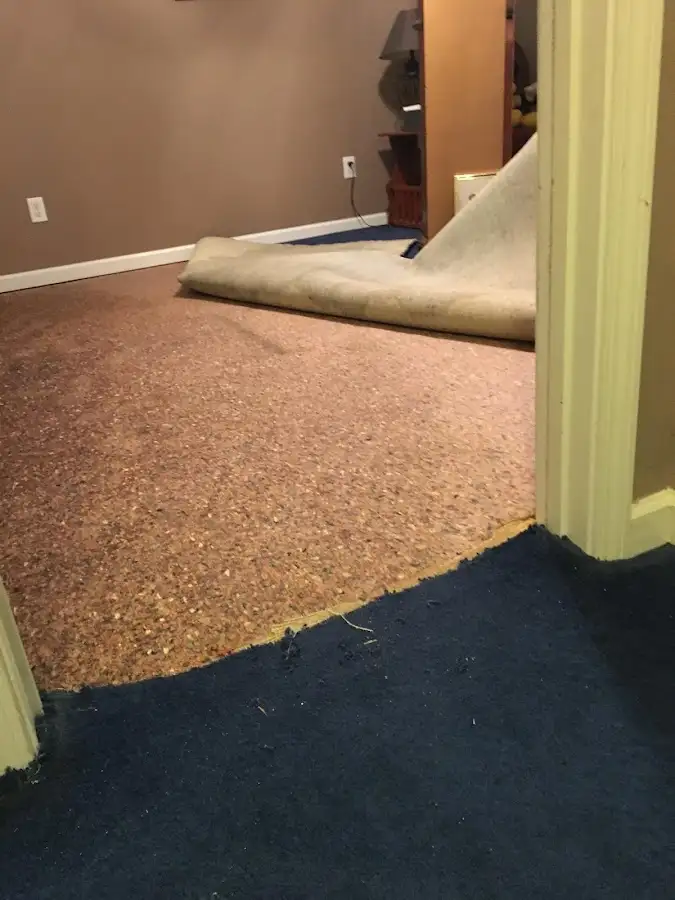 Carpet pad removal revealing water damage during Drying & Dehumidification in San Angelo